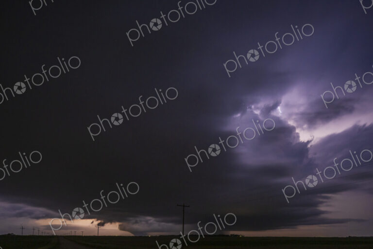 Fully Developed Wedge Tornado on the Ground after Sunset with Lightning in the Supercell