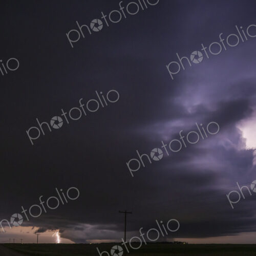 Fully Developed Wedge Tornado on the Ground after Sunset with Lightning in the Supercell