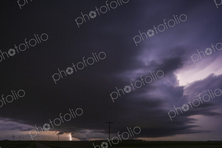 Fully Developed Wedge Tornado on the Ground after Sunset with Lightning in the Supercell