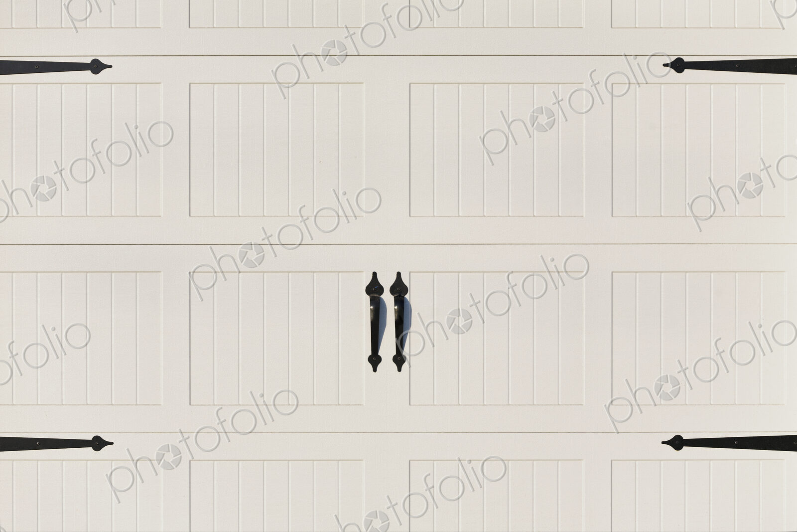 Garage doors, white painted panelled double doors with black metalwork brackets and…