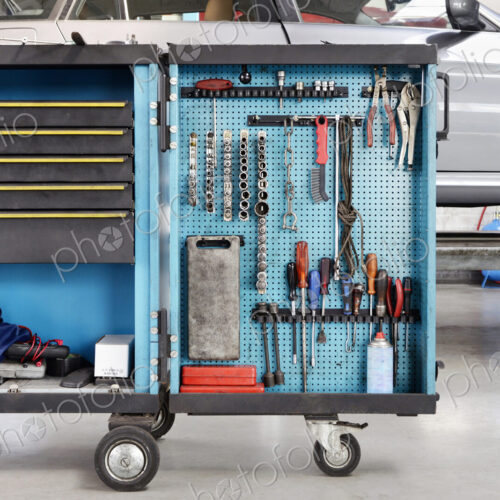 Garage or car repair workshop with tool cart.