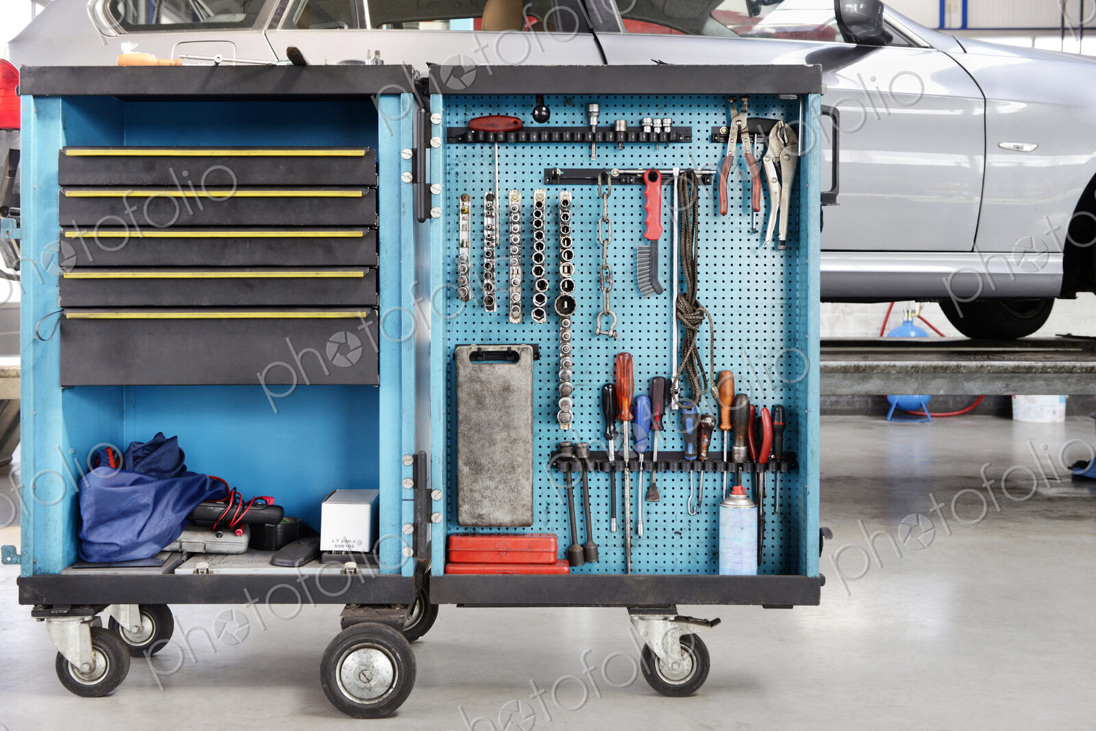 Garage or car repair workshop with tool cart.