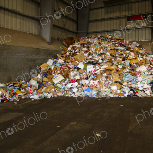 Garbage pile in transfer station, mixed waste in a heap.