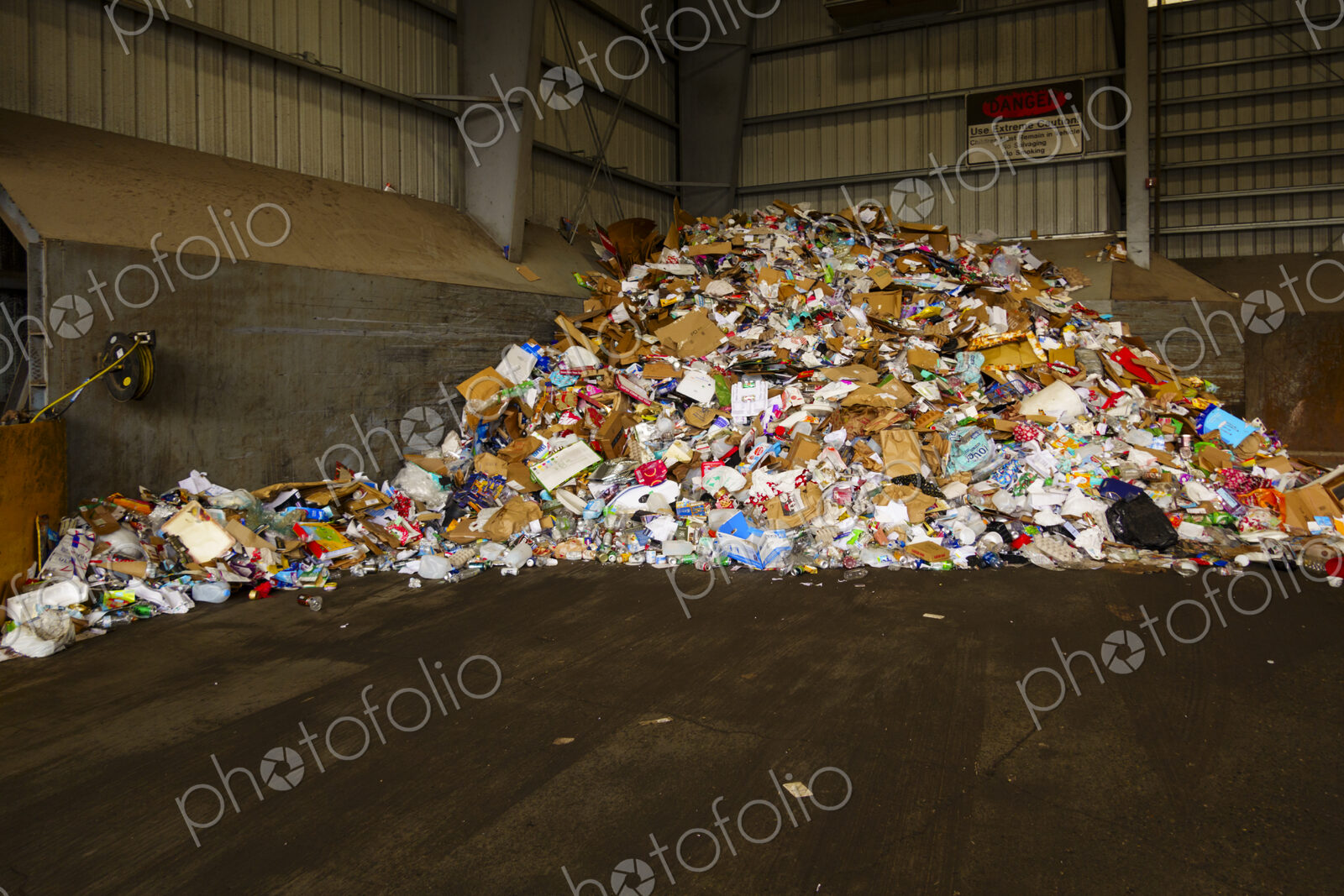 Garbage pile in transfer station, mixed waste in a heap.