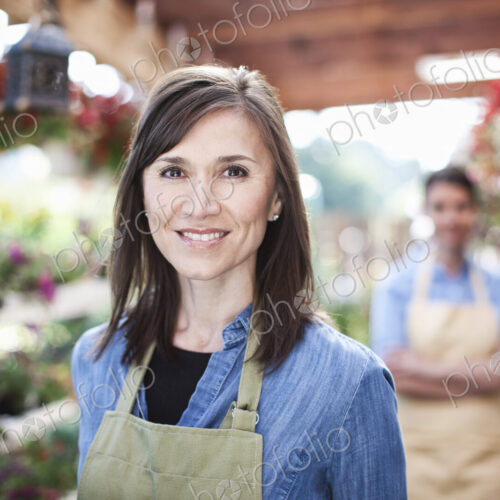Garden center nursery caucasian woman owner and employee.