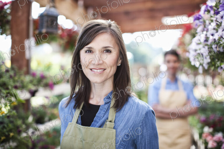 Garden center nursery caucasian woman owner and employee.