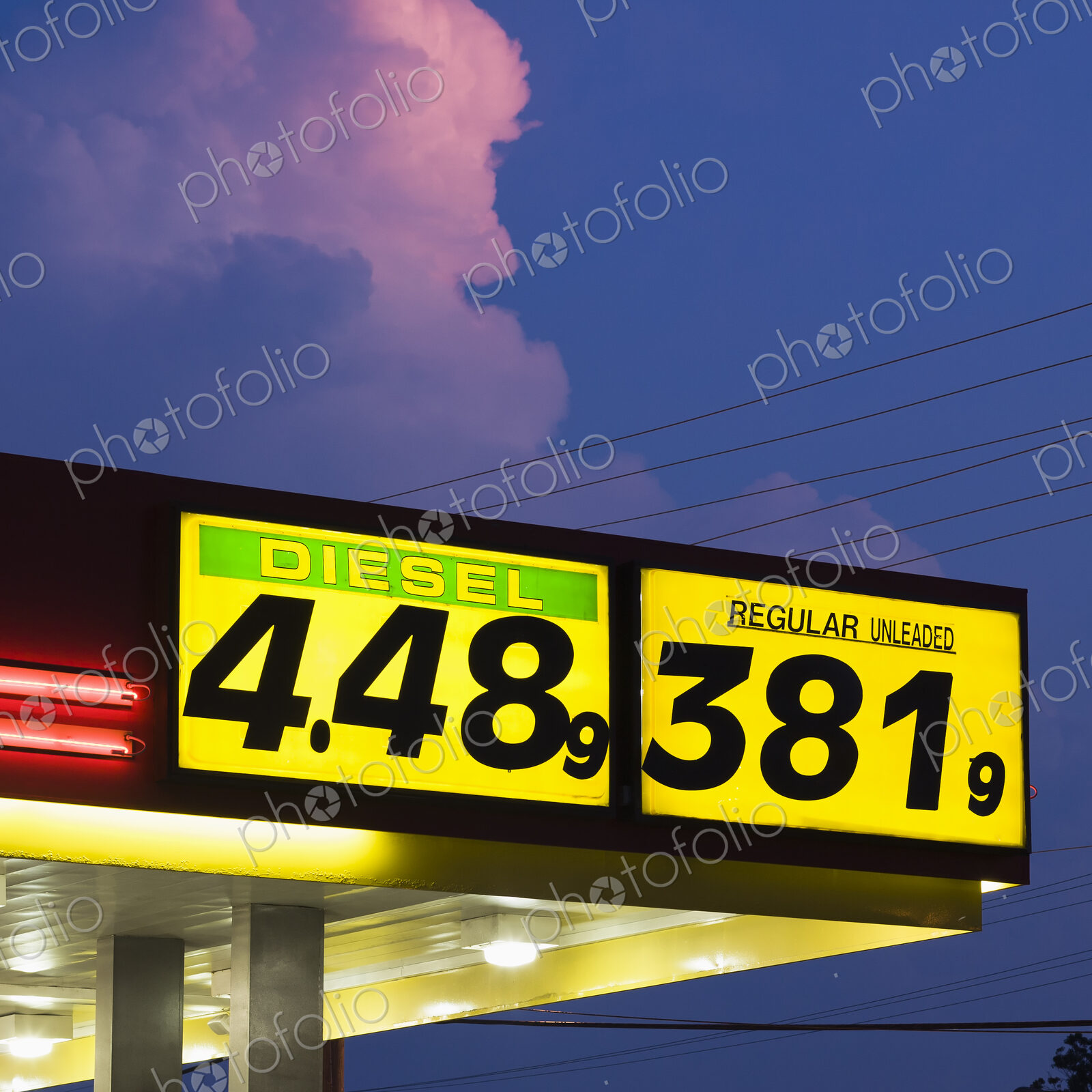 Gas Fuel Prices at a Filling Station, fuel costs, a garage under blue sky at dusk,