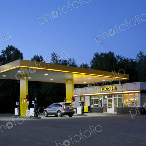 Gas station, petrol station on a road at dusk.