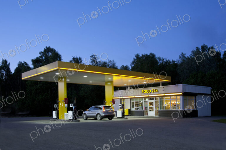 Gas station, petrol station on a road at dusk.