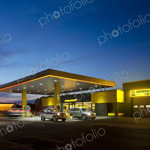 Gas station, petrol station on a road at dusk.