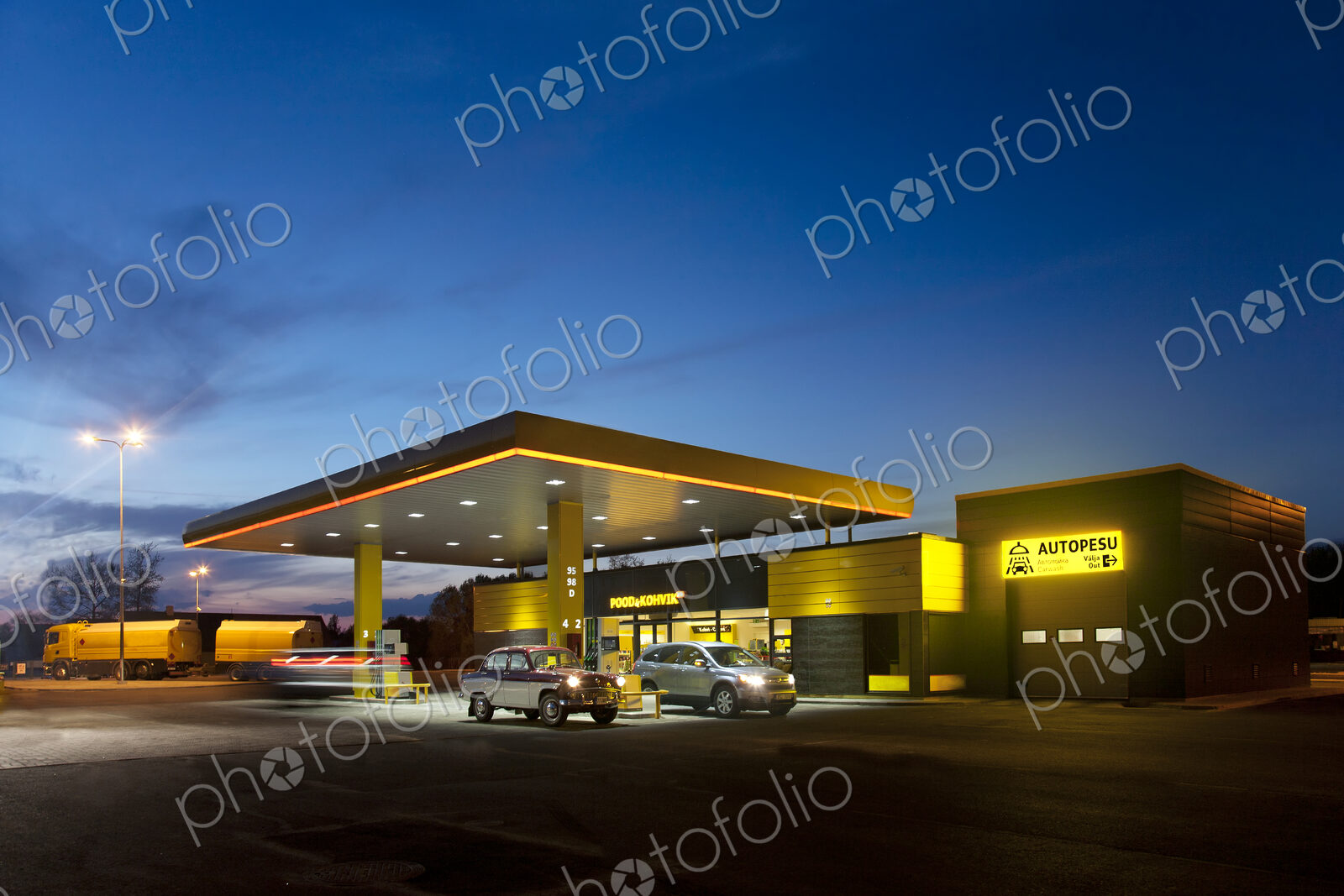 Gas station, petrol station on a road at dusk.