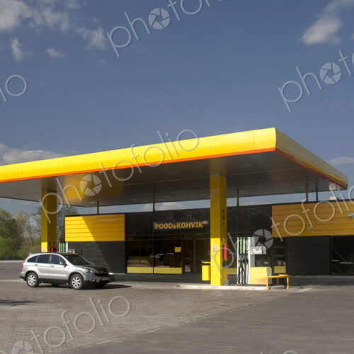 Gas station, petrol station on a road at dusk. Gas station, petrol station on a road at dusk.