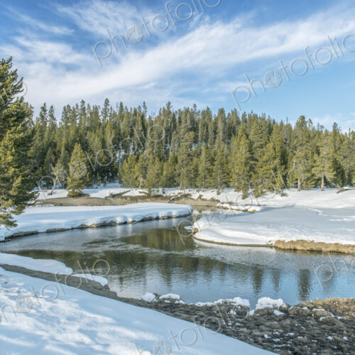 Gibbons River, water flowing around a bend in the river course, snow on the ground and… Gibbons River, water flowing around a bend in the river course, snow on the ground and…