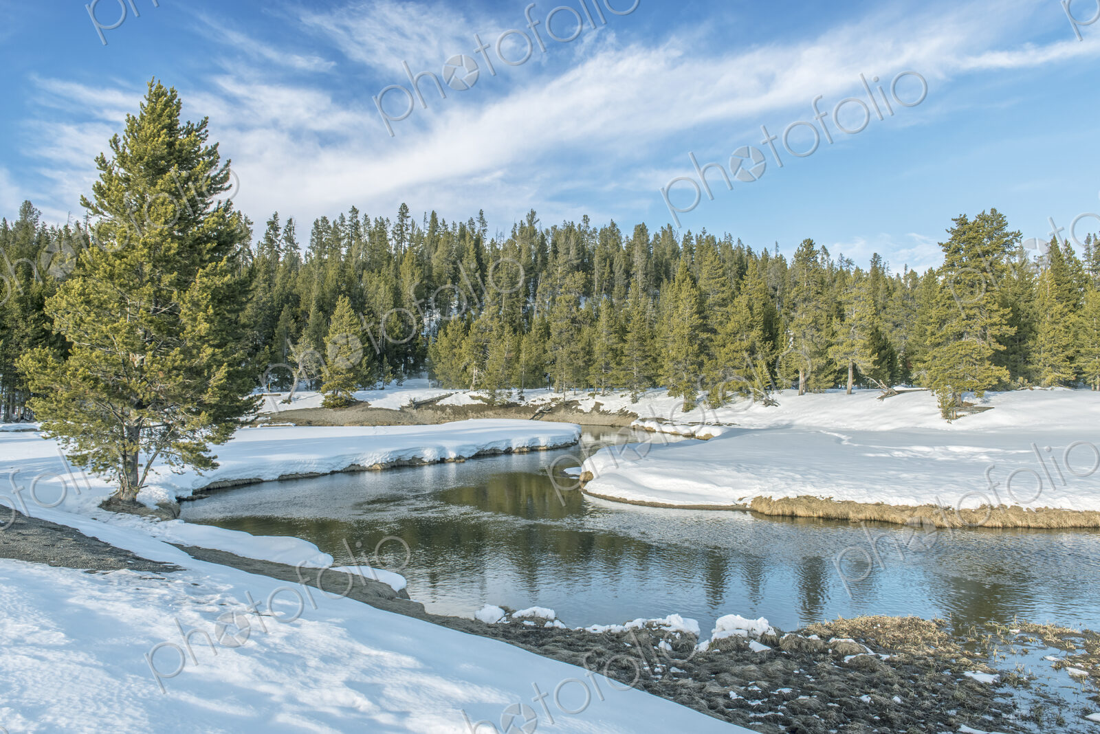 Gibbons River, water flowing around a bend in the river course, snow on the ground and…