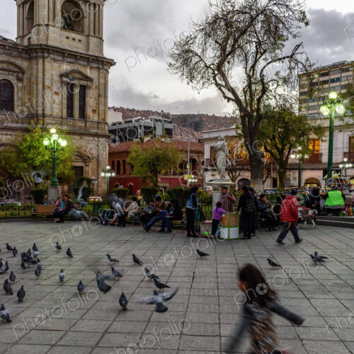 Girl chasing pigeons in Plaza Murillo, the central plaza of La Paz, Bolivia. Girl chasing pigeons in Plaza Murillo, the central plaza of La Paz, Bolivia.