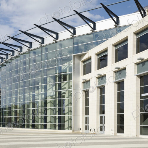 Glass Facade On Building with curved exterior and ticket booth
