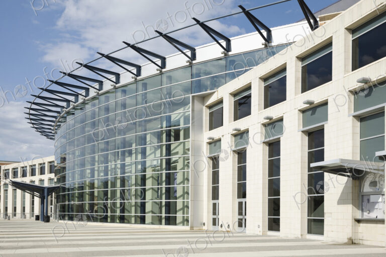 Glass Facade On Building with curved exterior and ticket booth