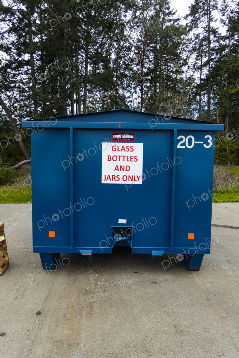 Glass bottles and containers in recycling bin, Port Angeles, WA USA