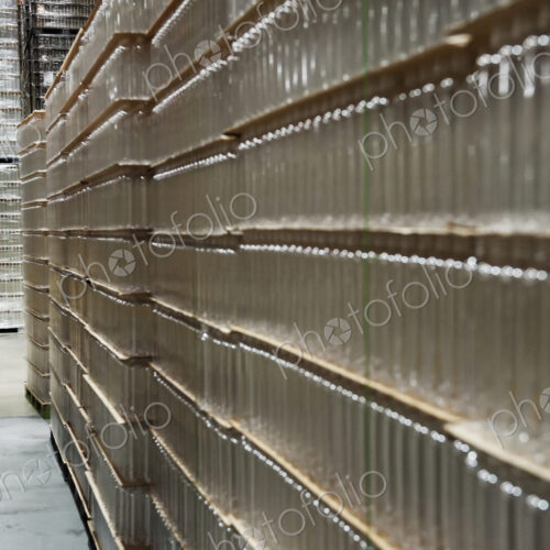 Glass bottles stacked in warehouse Glass bottles stacked in warehouse