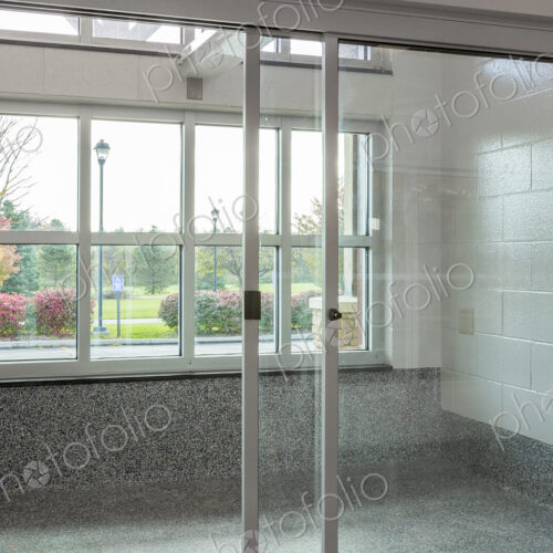Glass doors to holding area in animal shelter Glass doors to holding area in animal shelter