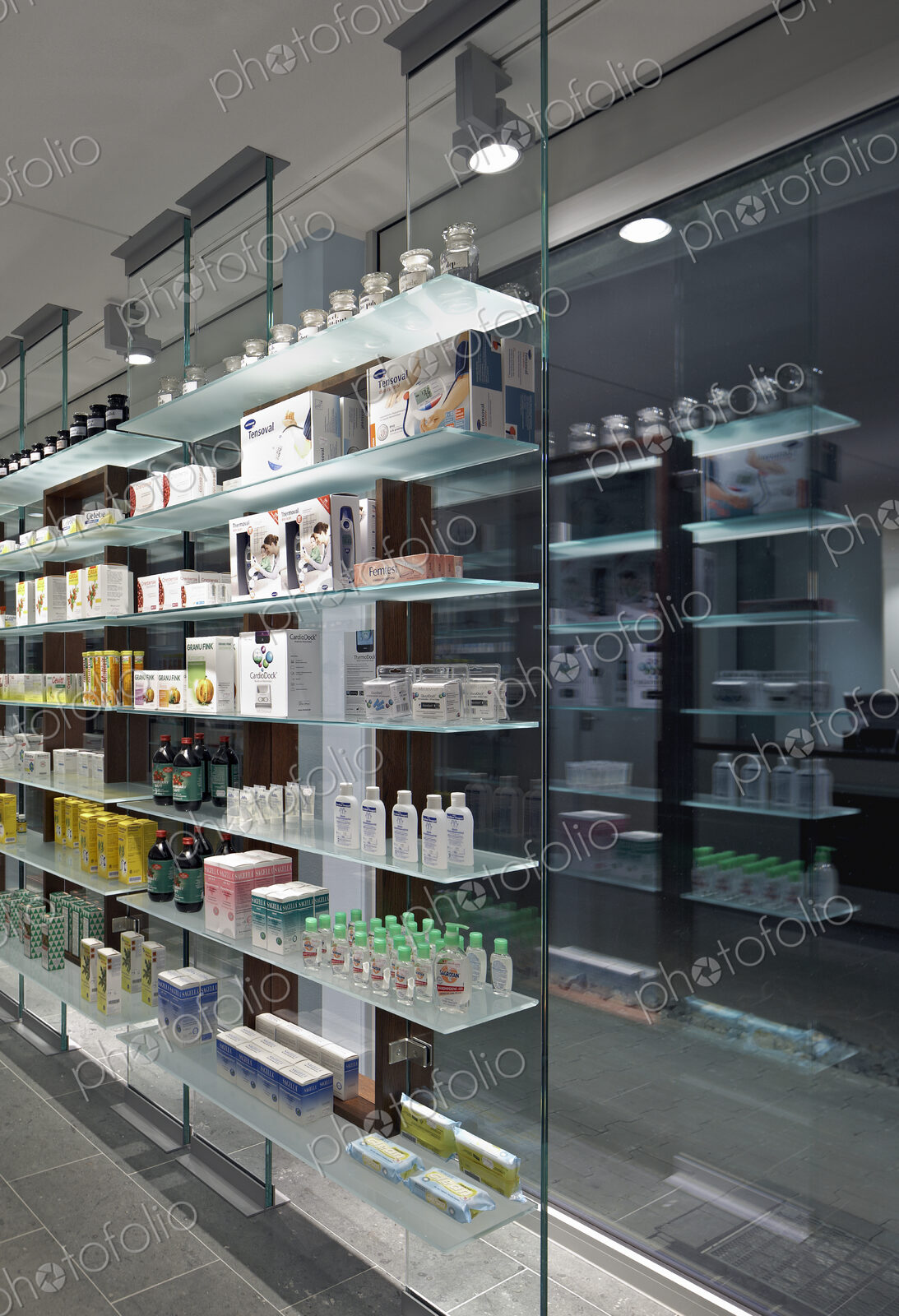 Glass shelves and windows in modern pharmacy