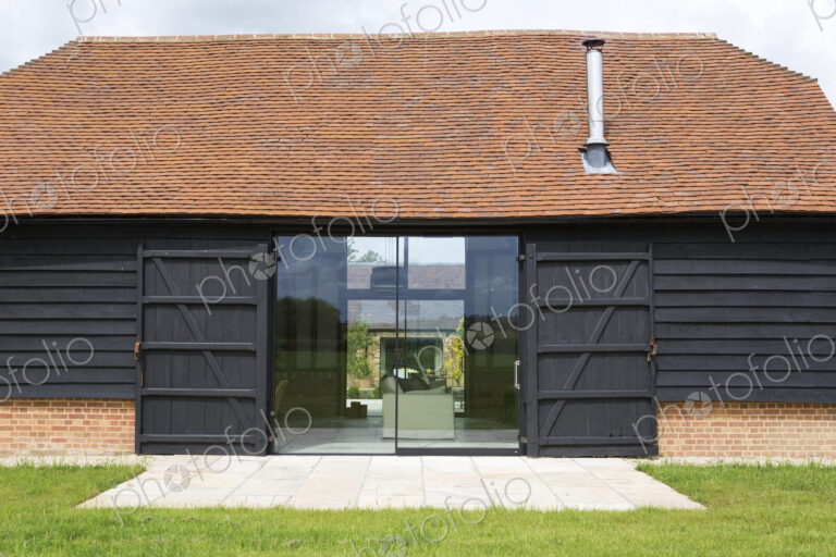 Glass sliding doors of converted barn home