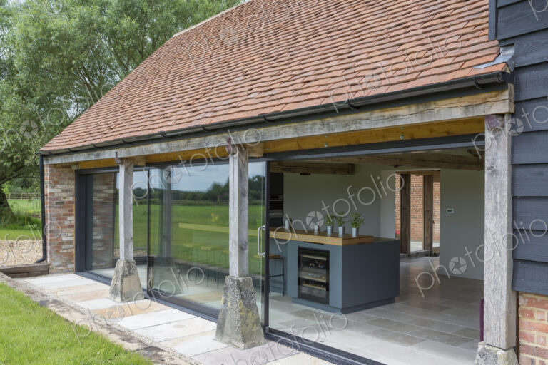 Glass sliding doors of converted barn home