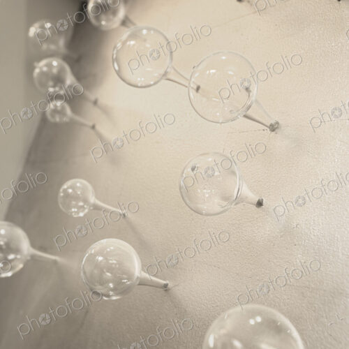 Glass spheres on concrete wall. Glass spheres on concrete wall.