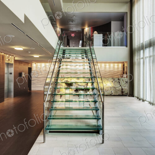 Glass staircase in hotel lobby Glass staircase in hotel lobby