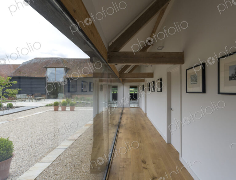 Glass wall and hallway of modern home