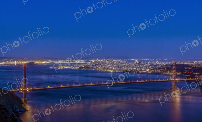 Golden Gate bridge across San Francisco bay at twilight.