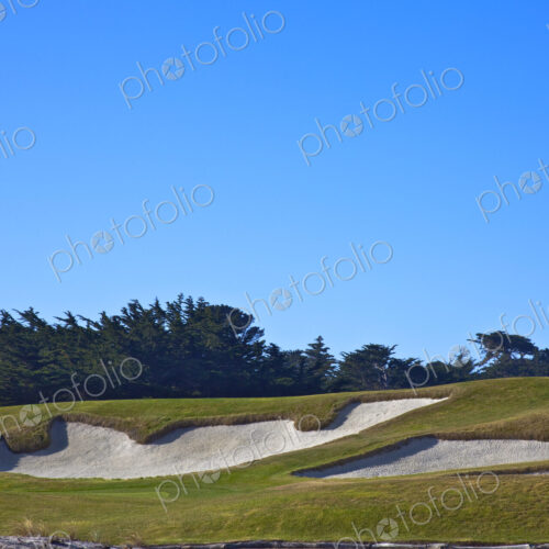 Golf course sand traps, on a course.