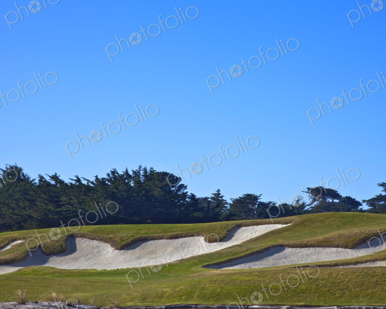 Golf course sand traps, on a course.