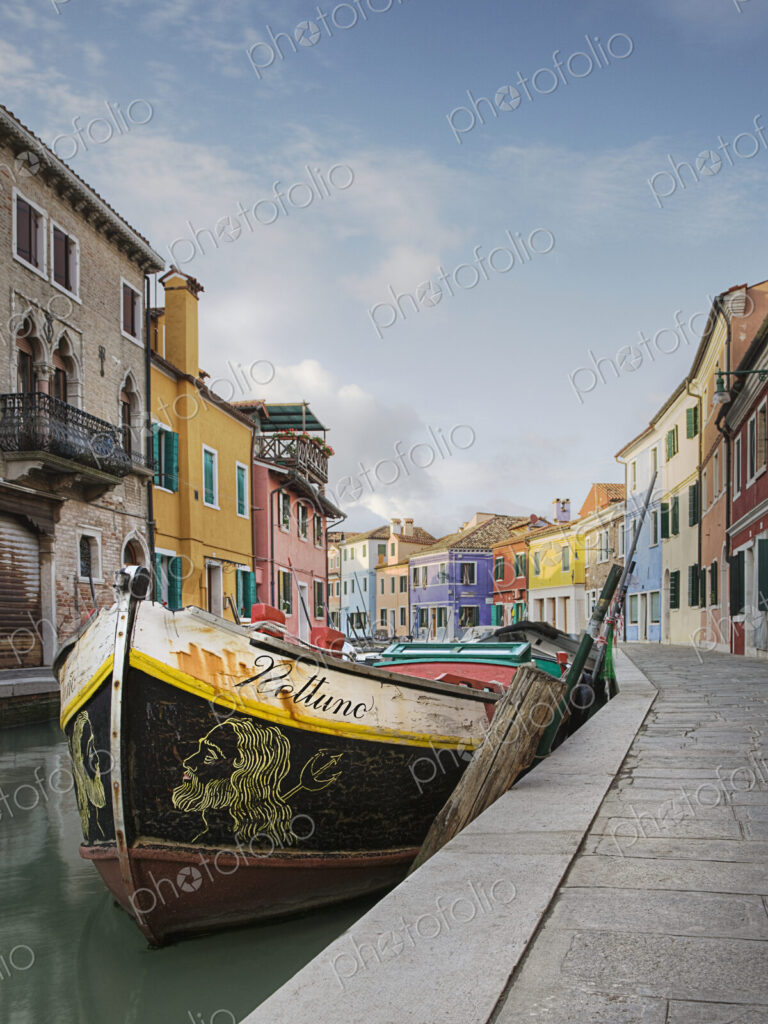 Gondola moored on canal, Venice, Italy