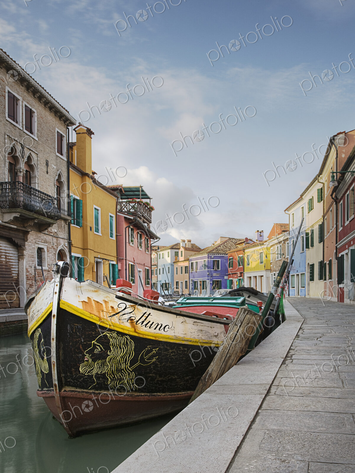 Gondola moored on canal, Venice, Italy
