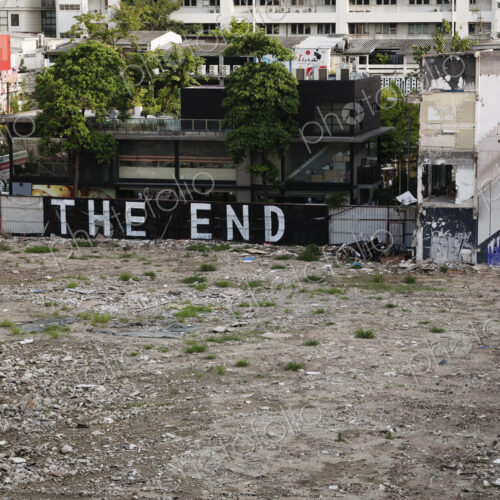 Graffiti that reads "THE END" in an empty lot, urban scene overlooking wasteland in… Graffiti that reads "THE END" in an empty lot, urban scene overlooking wasteland in…