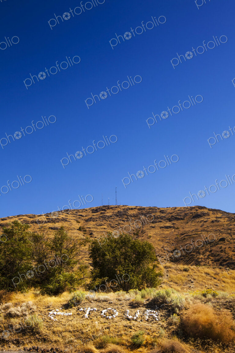 Grand Coulee Dam, Electric City, a view from a distance of the terrain around the dam,…