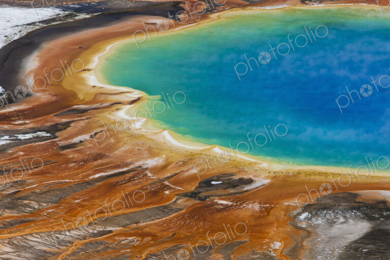 Grand Prismatic Spring, a bright turquoise pool and site of geothermal activity, with…