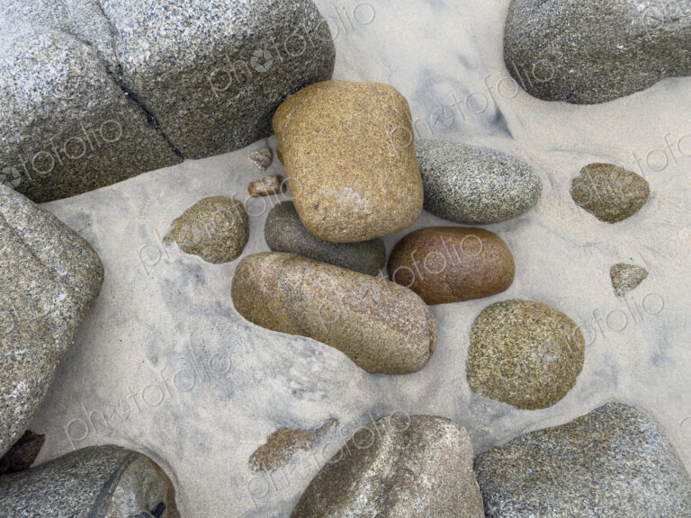 Granite Rocks on the Beach, smoothed by water and sand erosion.
