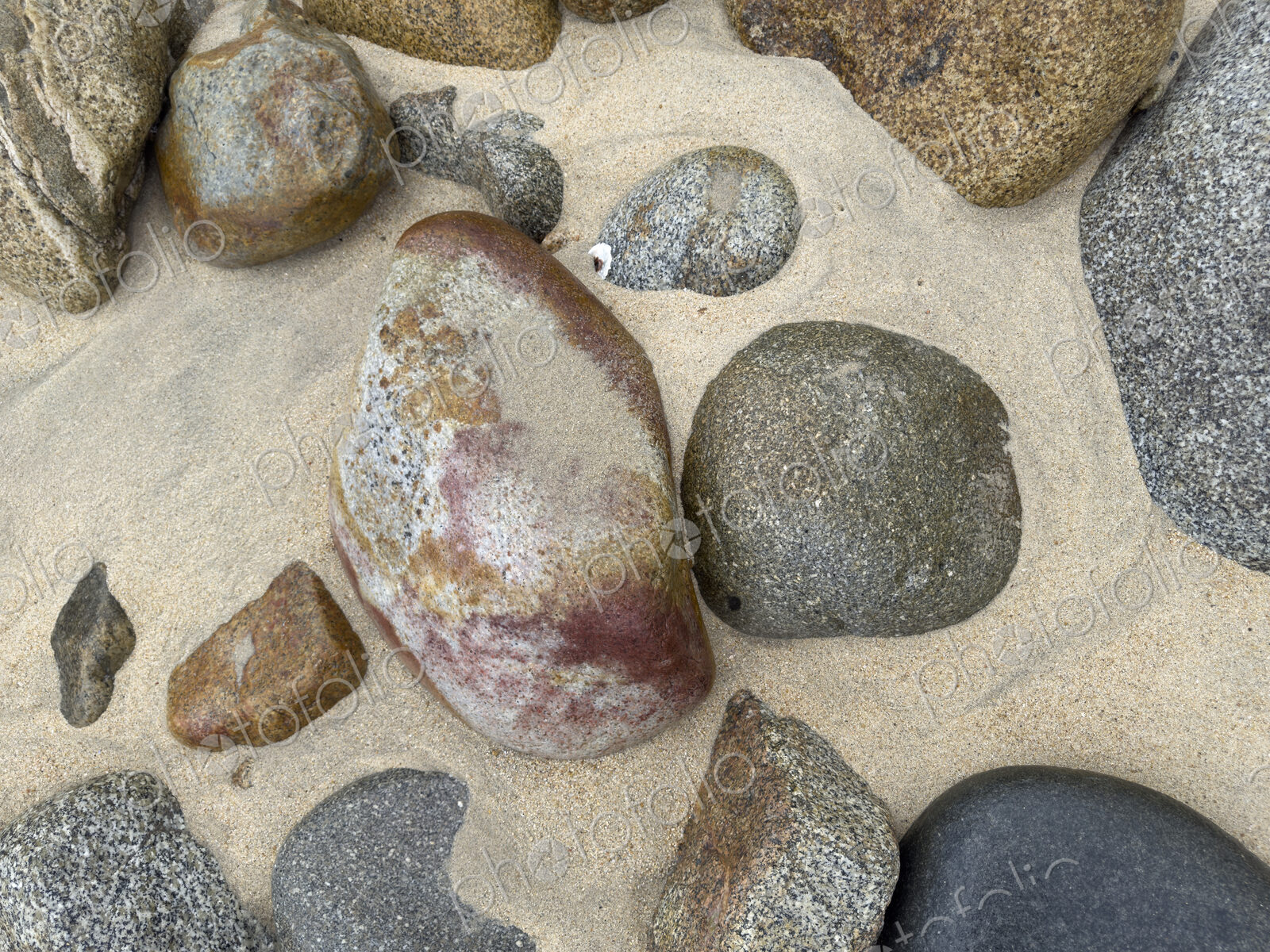 Granite Rocks on the Beach, smoothed by water and sand erosion.