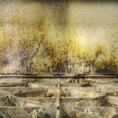 Greasy gas stove top in old catering kitchen. Greasy gas stove top in old catering kitchen.