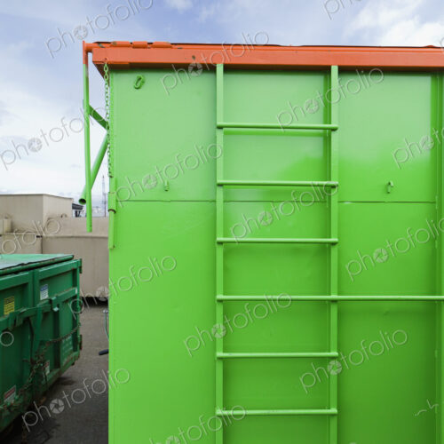 Green And Orange Garbage Container