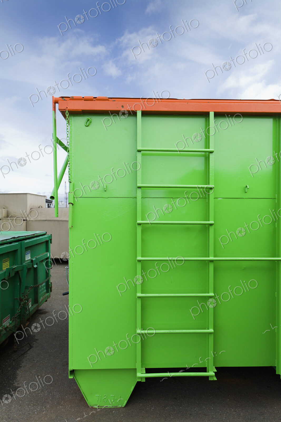 Green And Orange Garbage Container