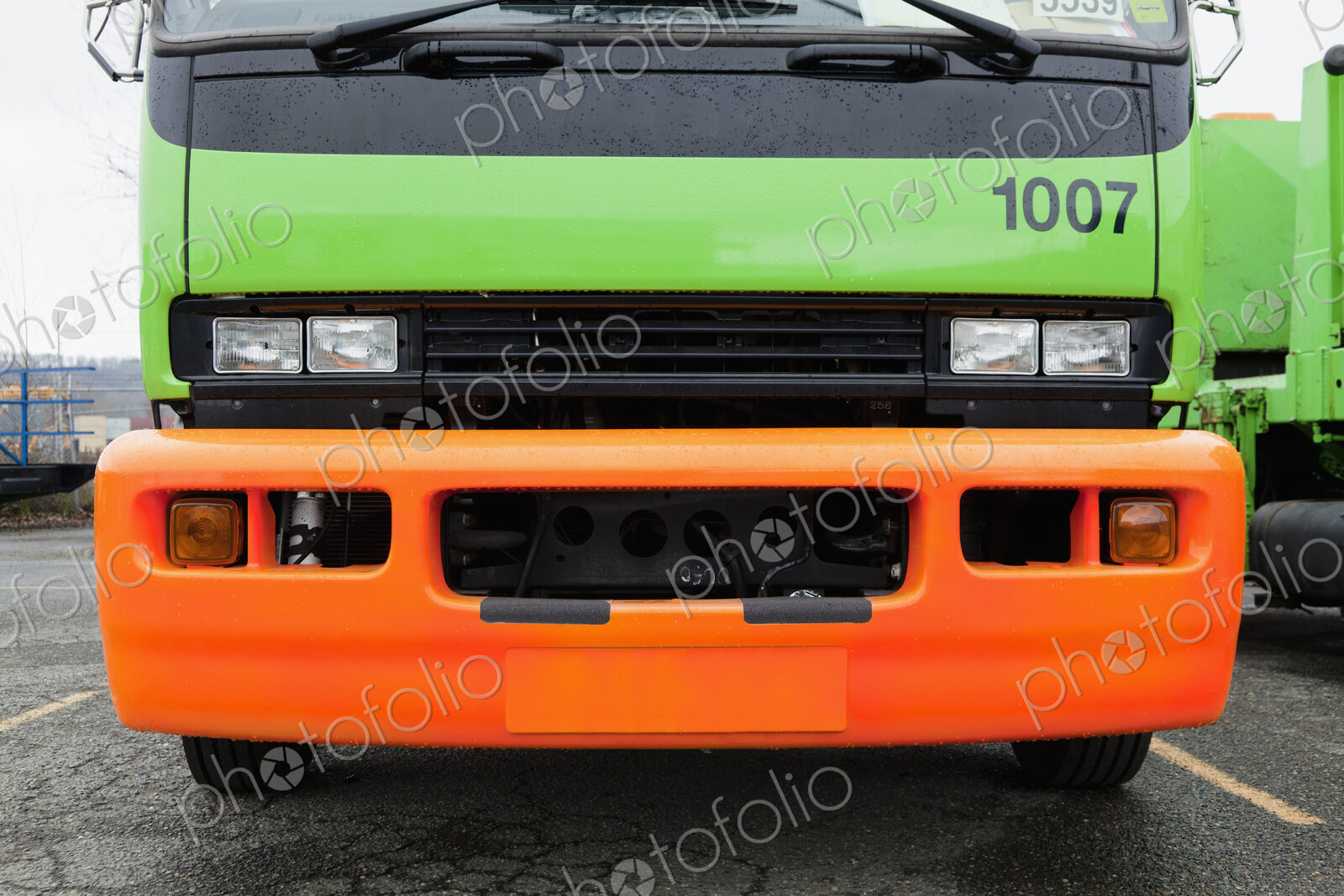 Green And Orange Garbage Truck