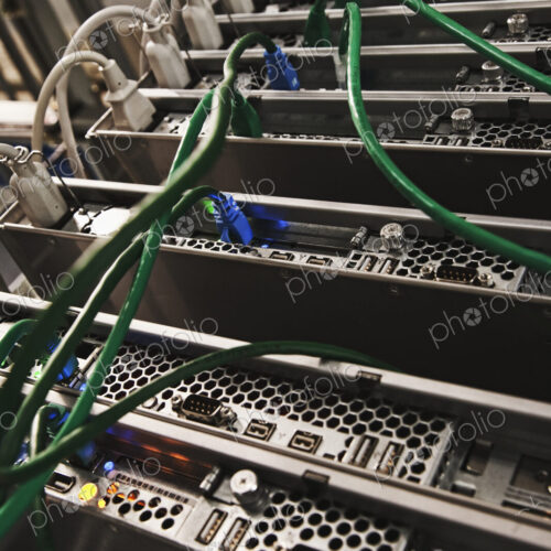 Green Cables Connected to the Back of a Server
