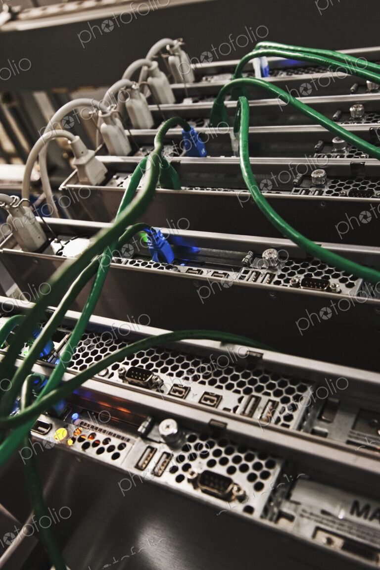 Green Cables Connected to the Back of a Server