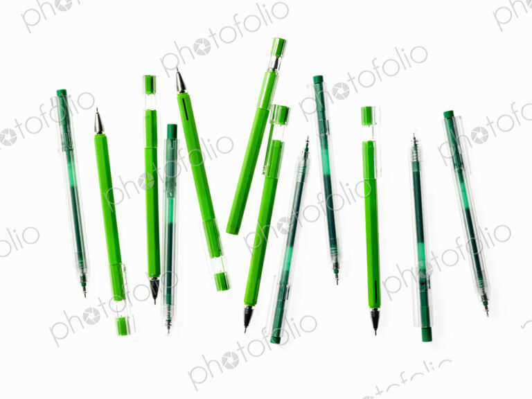 Green Office Supplies. A group of pens, blue and green colours.