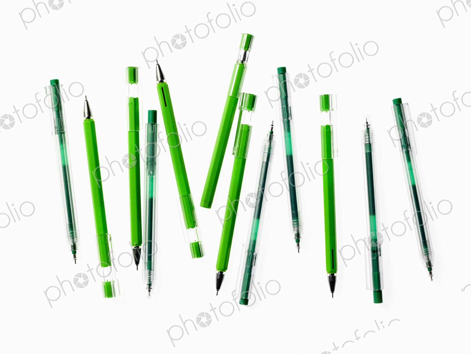 Green Office Supplies. A group of pens, blue and green colours.
