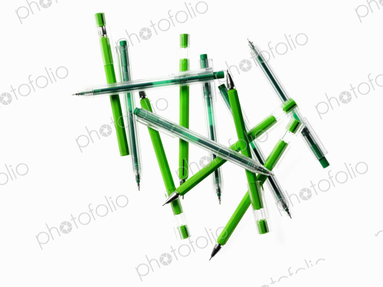 Green Office Supplies. A group of pens, blue and green colours.