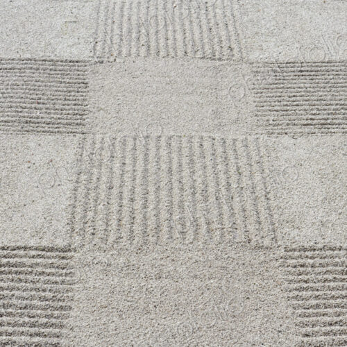 Grid pattern of raked gravel at a temple